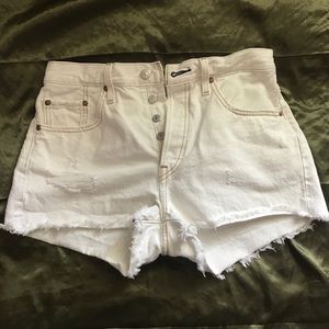 white button-up Levi shorts with front rips